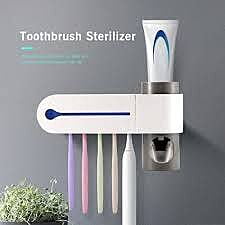 TOOTH BRUSH HOLDERS AND TOOTH PASTER DISPENSER  WITH BRUSH STERILIZER